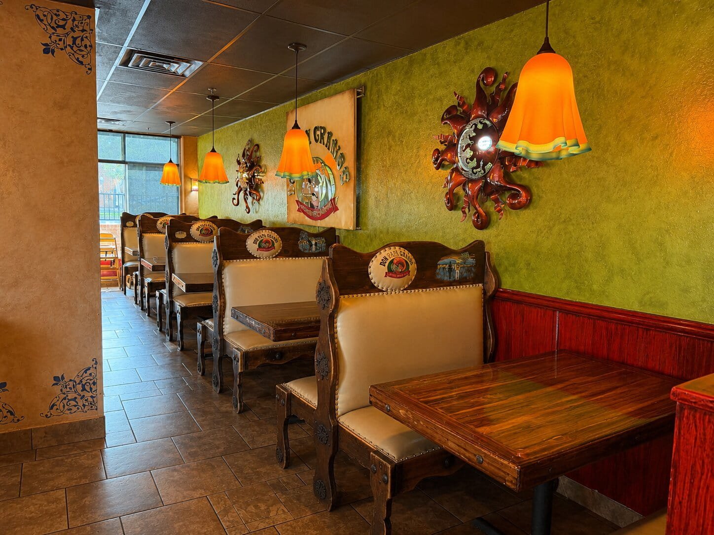 Booth seating and tables inside Don Papa Grande